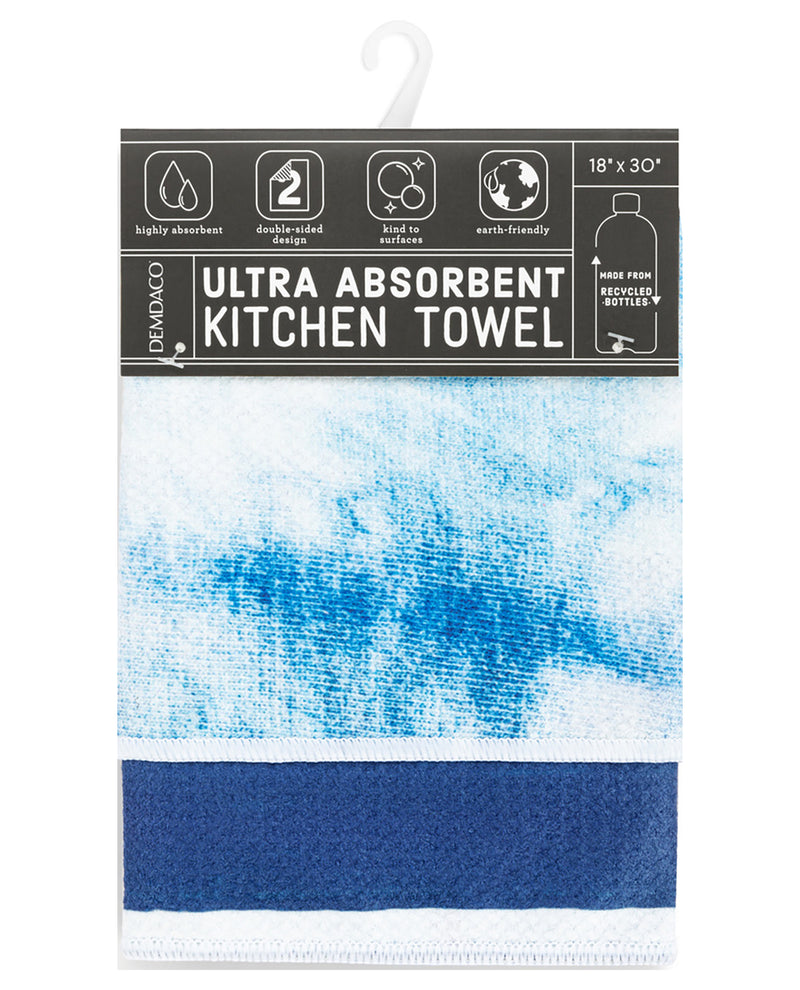 A packaged Demaco ultra absorbent kitchen towel with a white and blue watercolor-style pattern and a solid dark blue band at the bottom, shown on a white background.