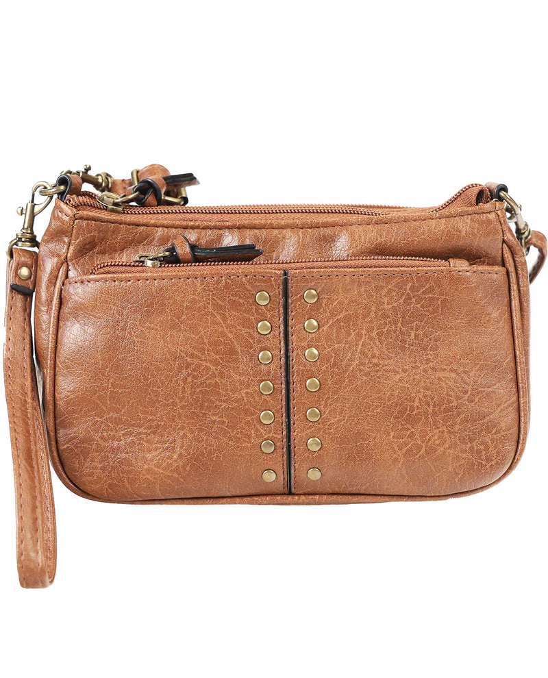 A brown faux-leather crossbody handbag with a wristlet strap, featuring a vertical row of brass studs down the center front pocket, a top zipper closure, and a front slip pocket.