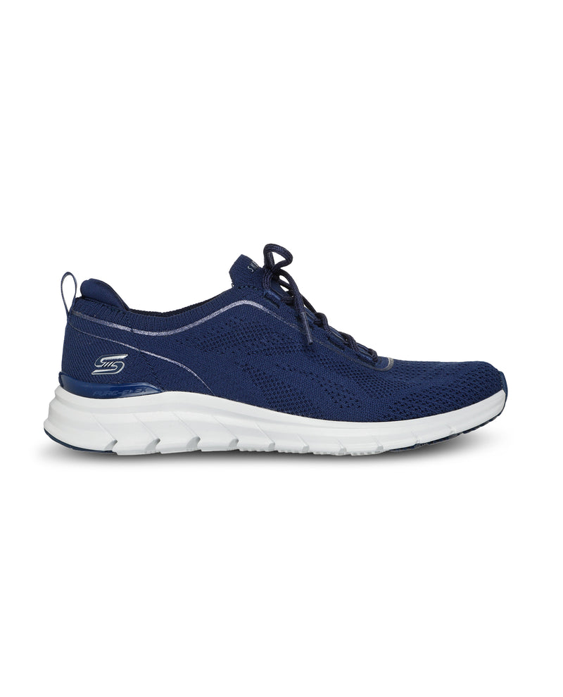 Navy running shoe with white sole on a white background