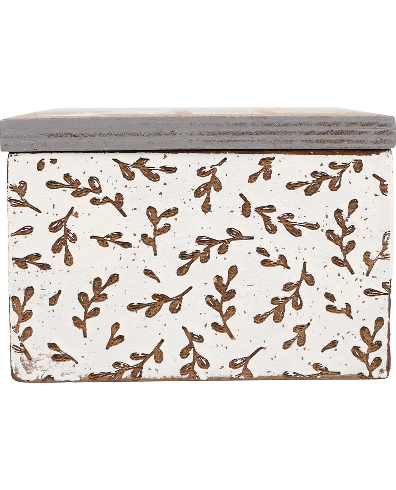 Decorative box with brown leaf pattern on a white background