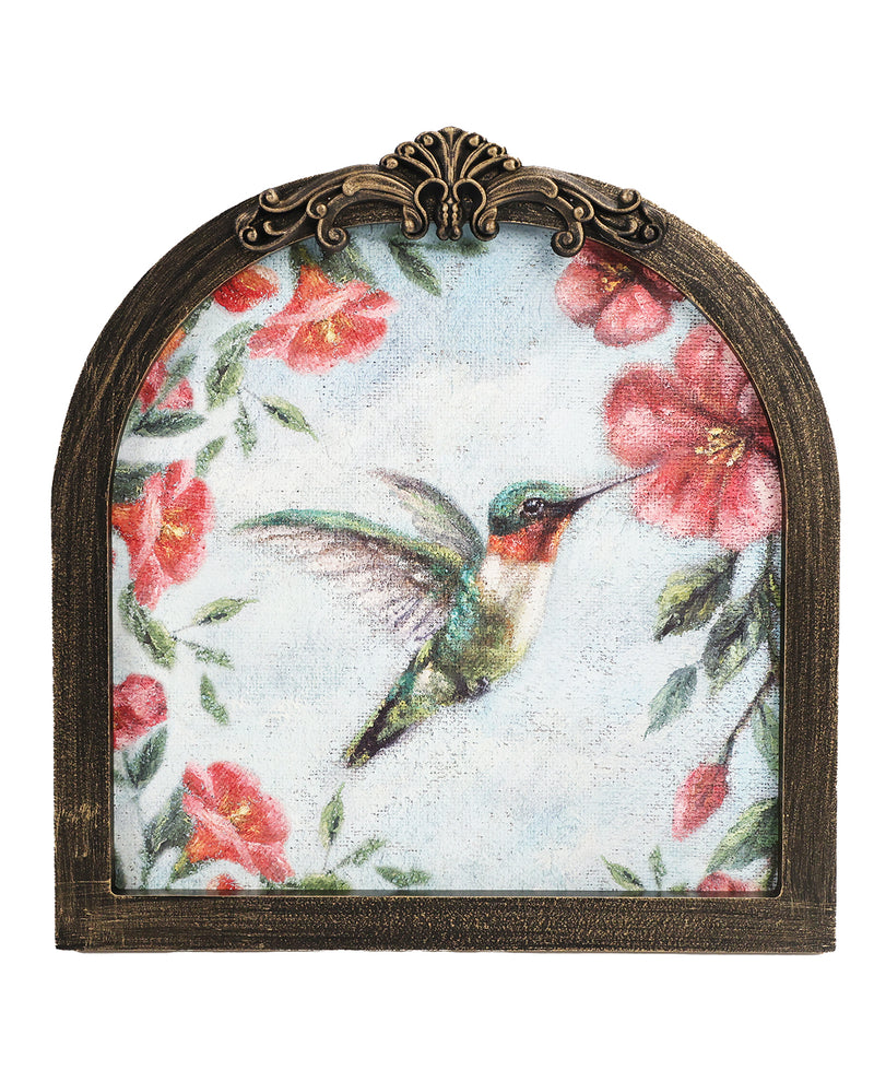 Decorative wall art with a hummingbird and floral design in an ornate frame.