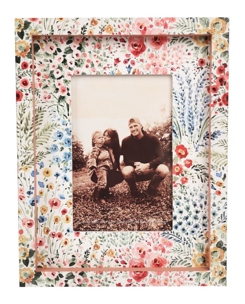 Floral photo frame with a black and white photo of a man and child inside
