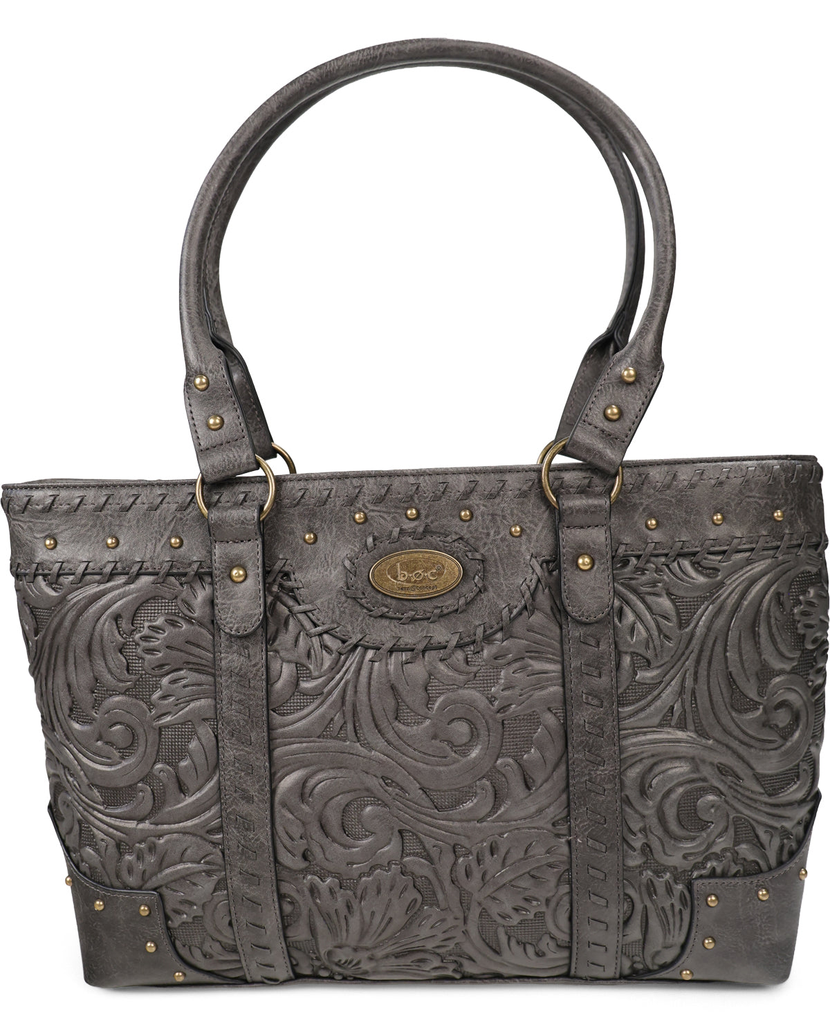 A dark gray tooled leather handbag with embossed floral scrollwork, brass-tone studs, and double top handles, shown against a plain white background.