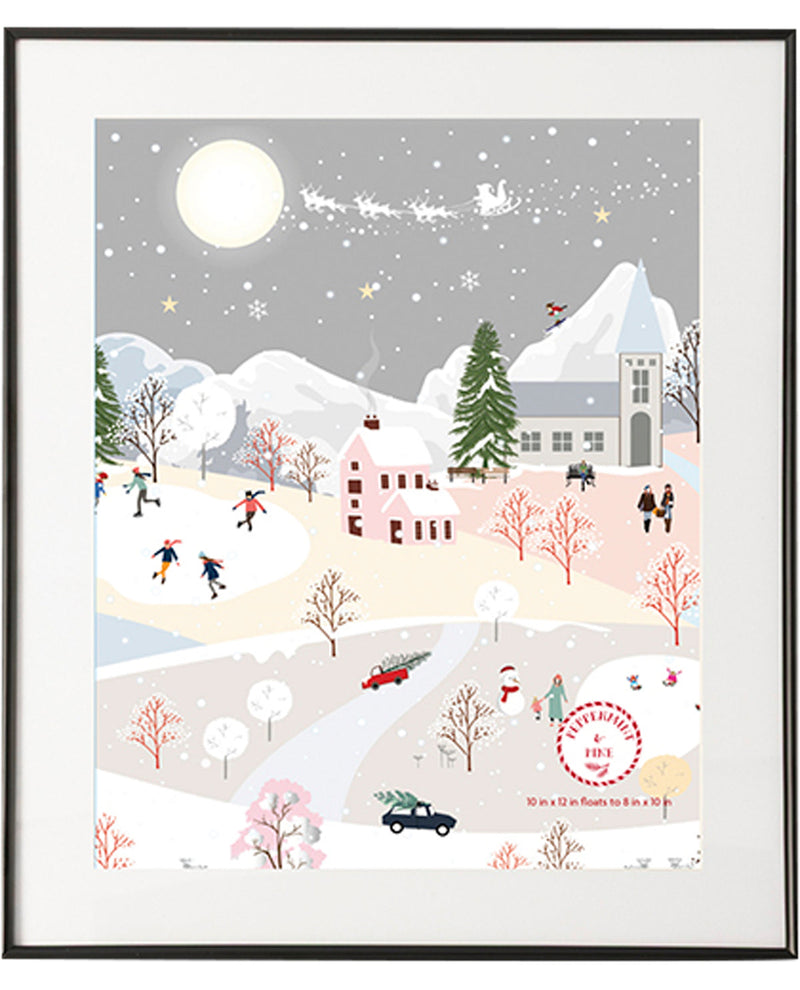 Framed artwork of a winter scene with snow-covered landscape, trees, and buildings.
