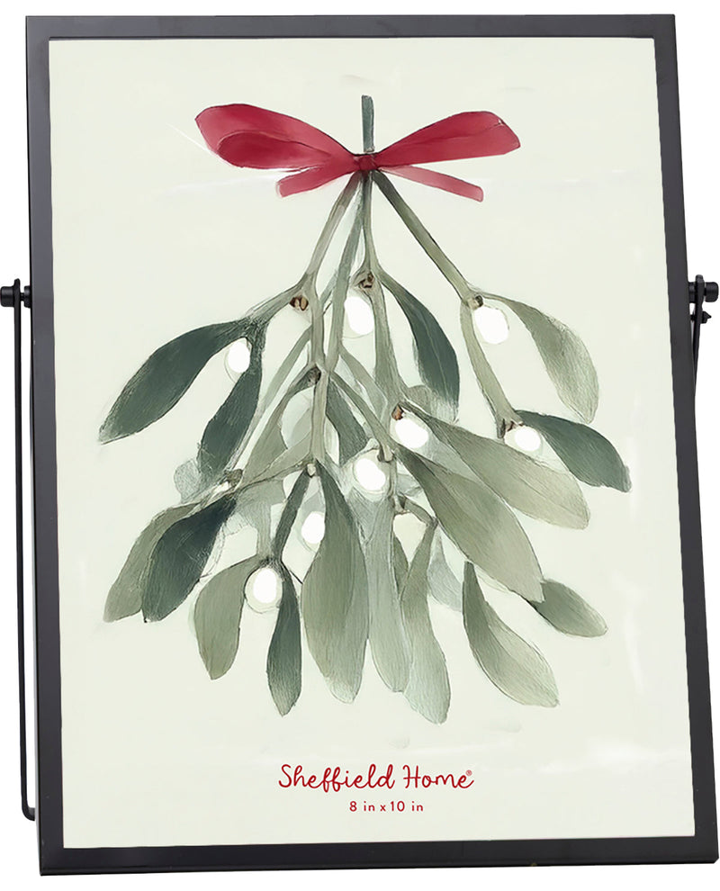 Framed artwork of mistletoe with a red bow and 'Sheffield Home' branding.