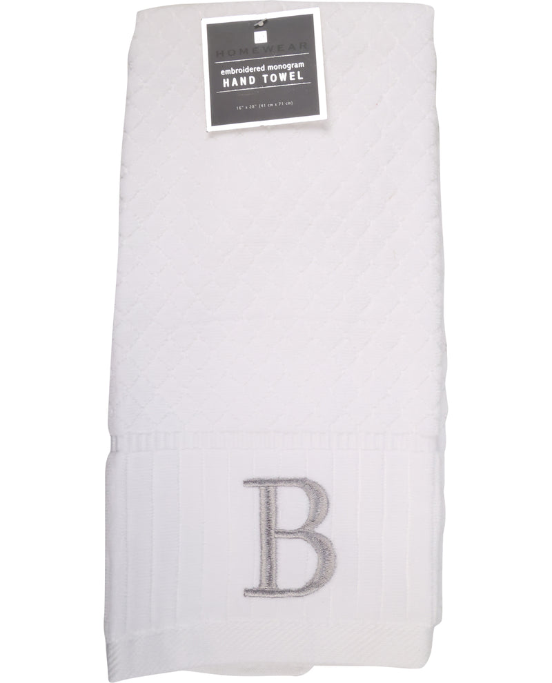White hand towel with letter 'B' embroidery and a label on a white background