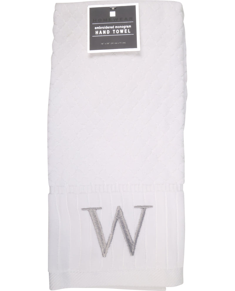 White hand towel with 'W' embroidery and a label on a white background