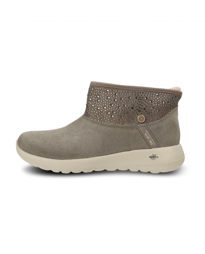 A olive suede ankle boot with a studded faux-leather collar and a thick, flexible sole, shown in a side profile on a white background.