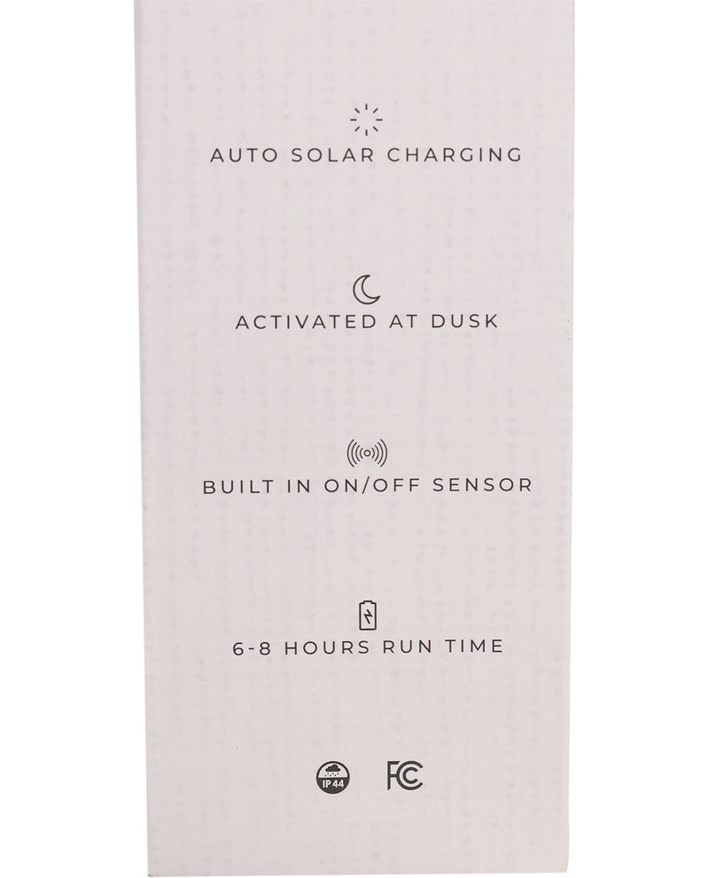 Product packaging with text about auto solar charging, dusk activation, on/off sensor, run time, and FCC certification.
