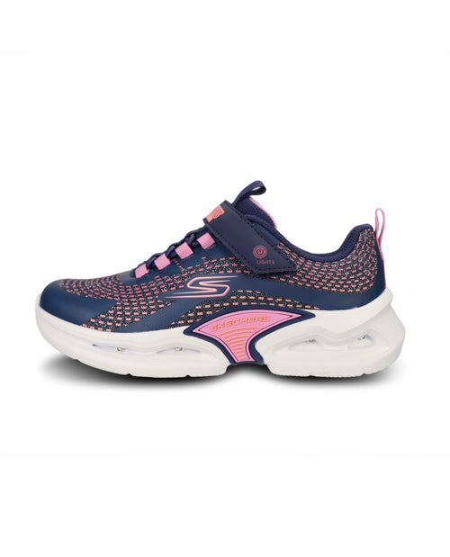 A Skechers sneaker in navy blue and pink, featuring a mesh upper, hook-and-loop strap closure, and a chunky white sole.