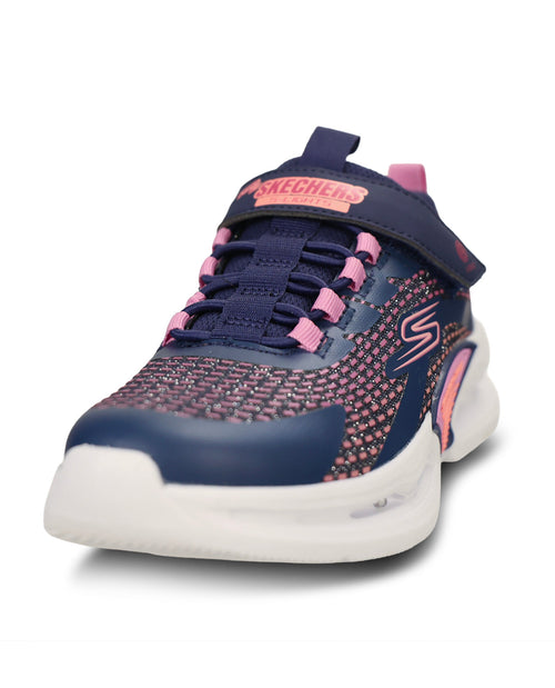 A Skechers toddler's athletic sneaker in navy blue and pink, featuring a knit pattern upper, hook-and-loop strap closure, and a white sole.