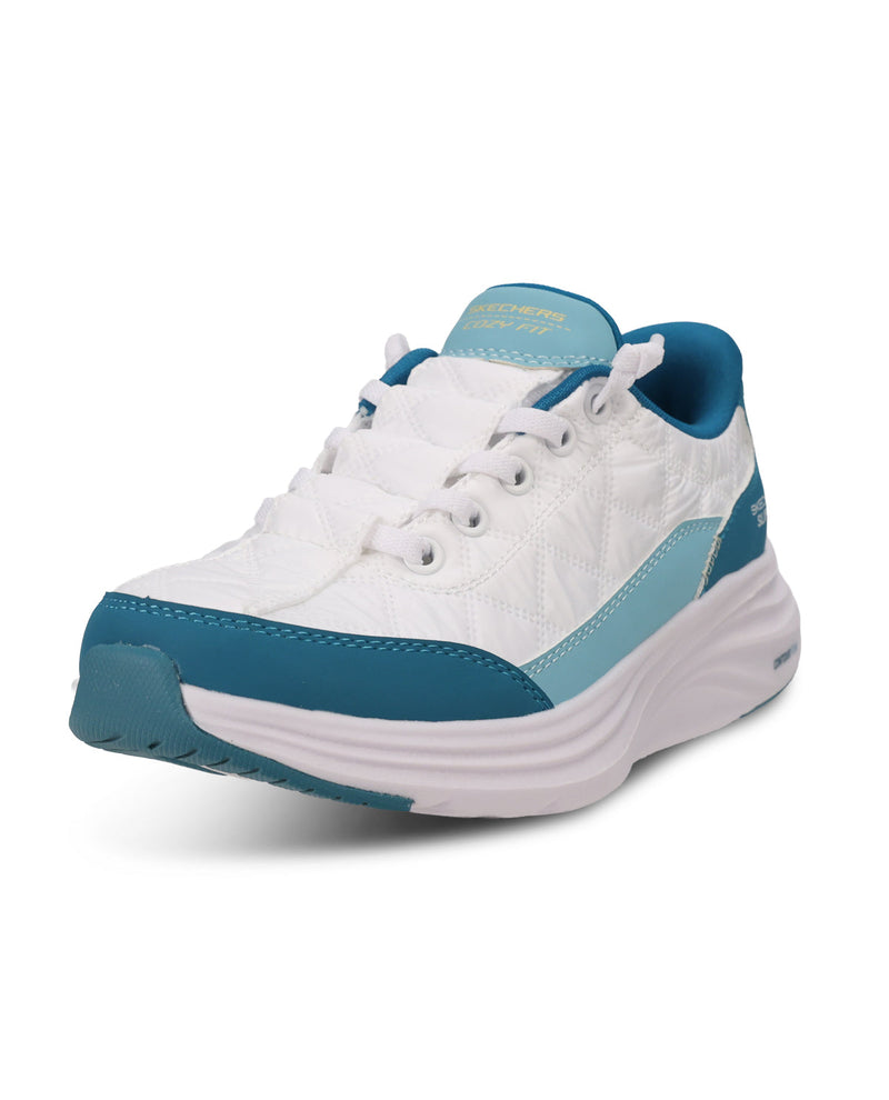 A white platform sneaker with teal blue accents on the toe, heel, and tongue, shown from a three-quarters angle on a white background.