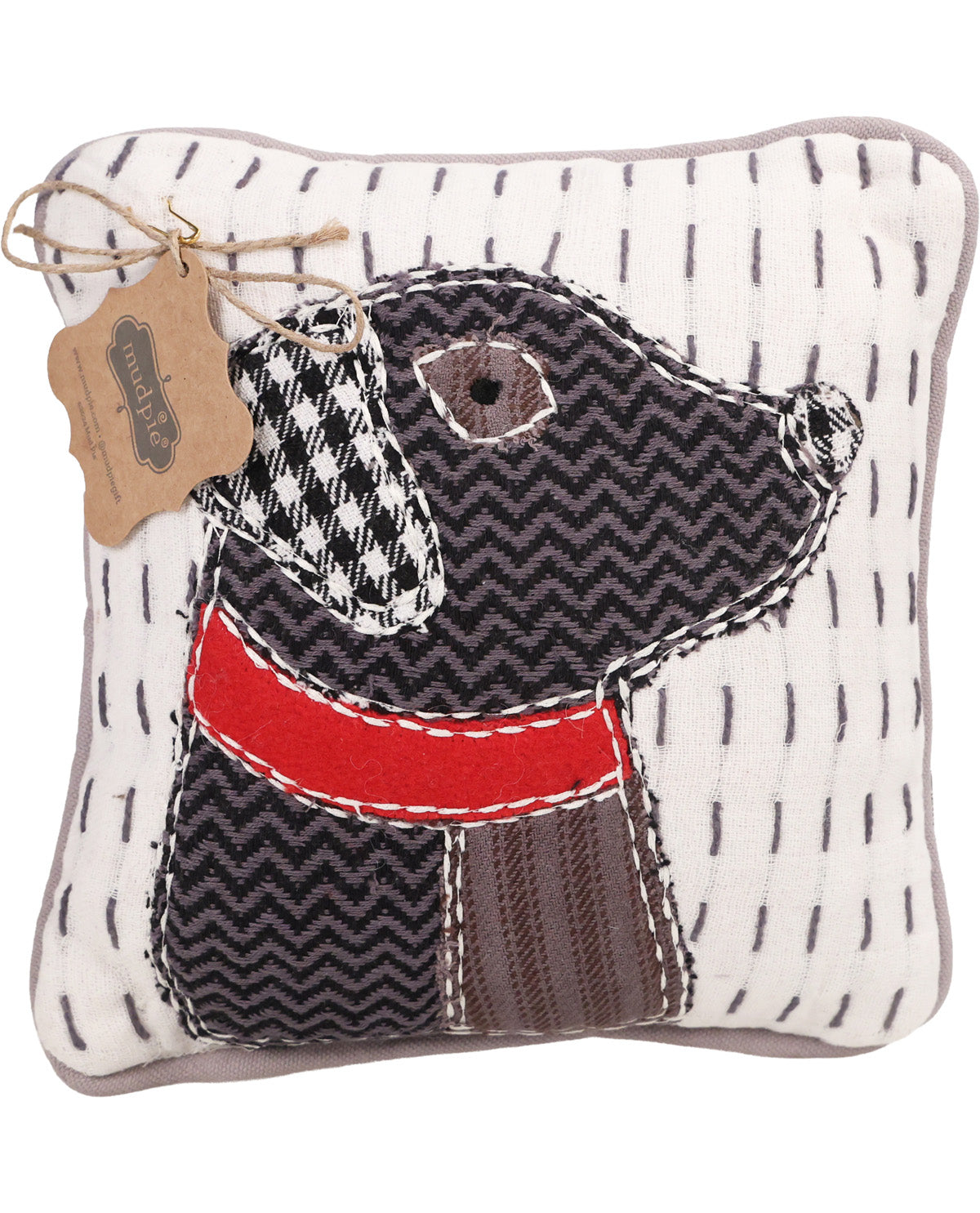 Fabric dog-shaped pillow with a houndstooth pattern and red bandana on a white background.