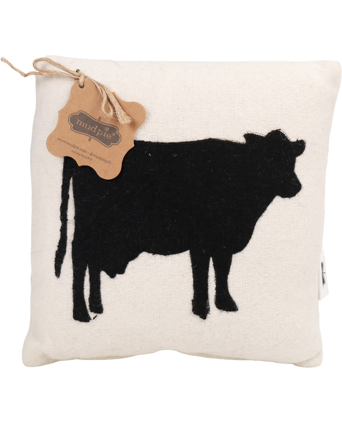 Decorative pillow with black cow silhouette and 'Mud Pie' tag on a white background