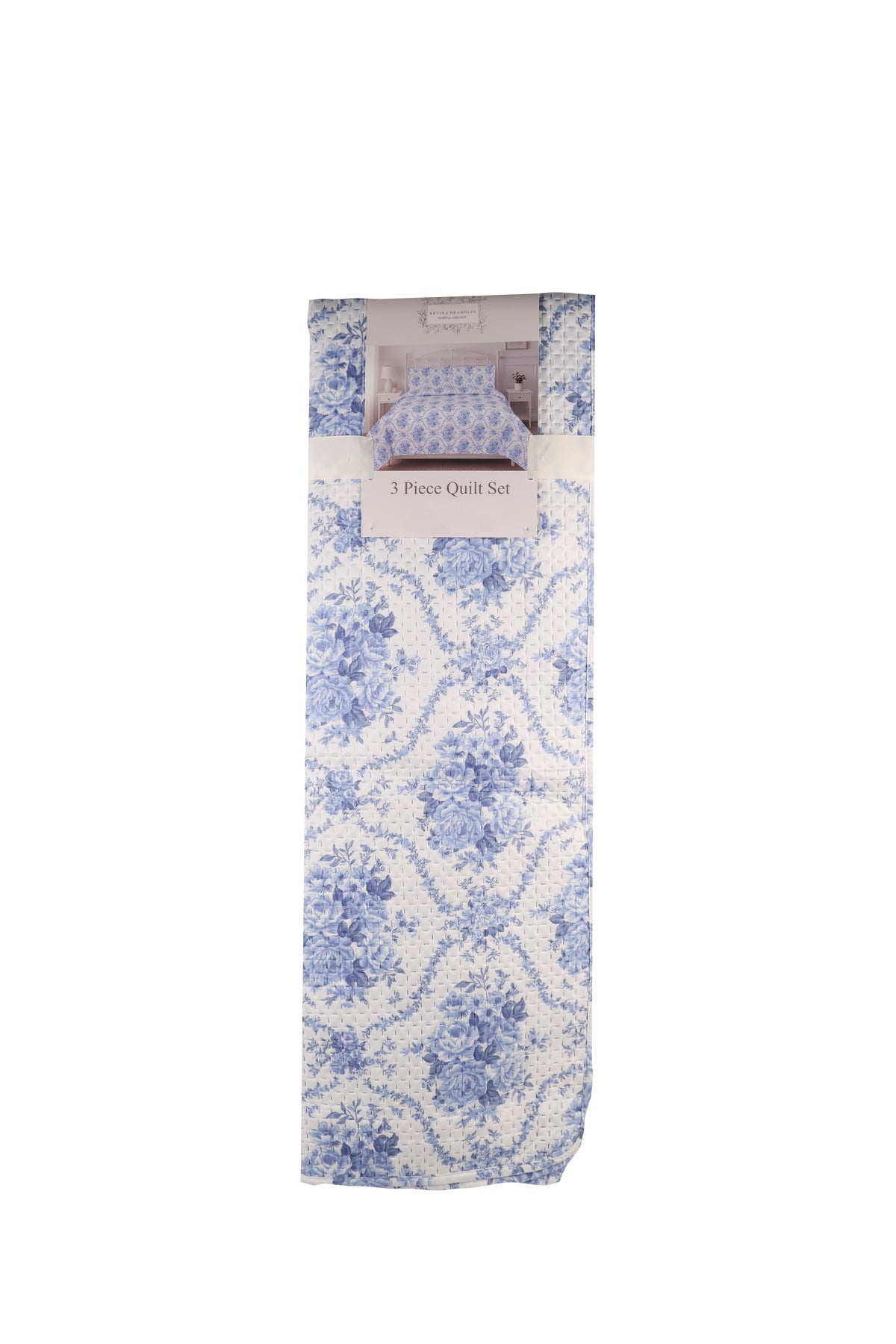 A folded 3-piece quilt set with a blue and white damask floral pattern, packaged with a white paper band label.