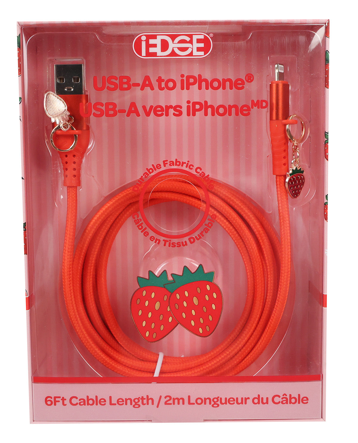 A red braided USB-A to iPhone charging cable in its original retail packaging. The packaging is pink and white striped with strawberry graphics, and the cable features a small strawberry keychain charm on the lightning connector.
