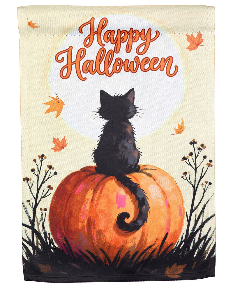 A vertical garden flag featuring a black cat sitting on a large orange pumpkin, with the words 'Happy Halloween' in orange script above. The design includes scattered orange autumn leaves, dark grass, and a pale cream background.