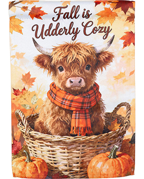 Cute cow in a basket with fall-themed decorations and text 'Fall is Udderly Cozy'.