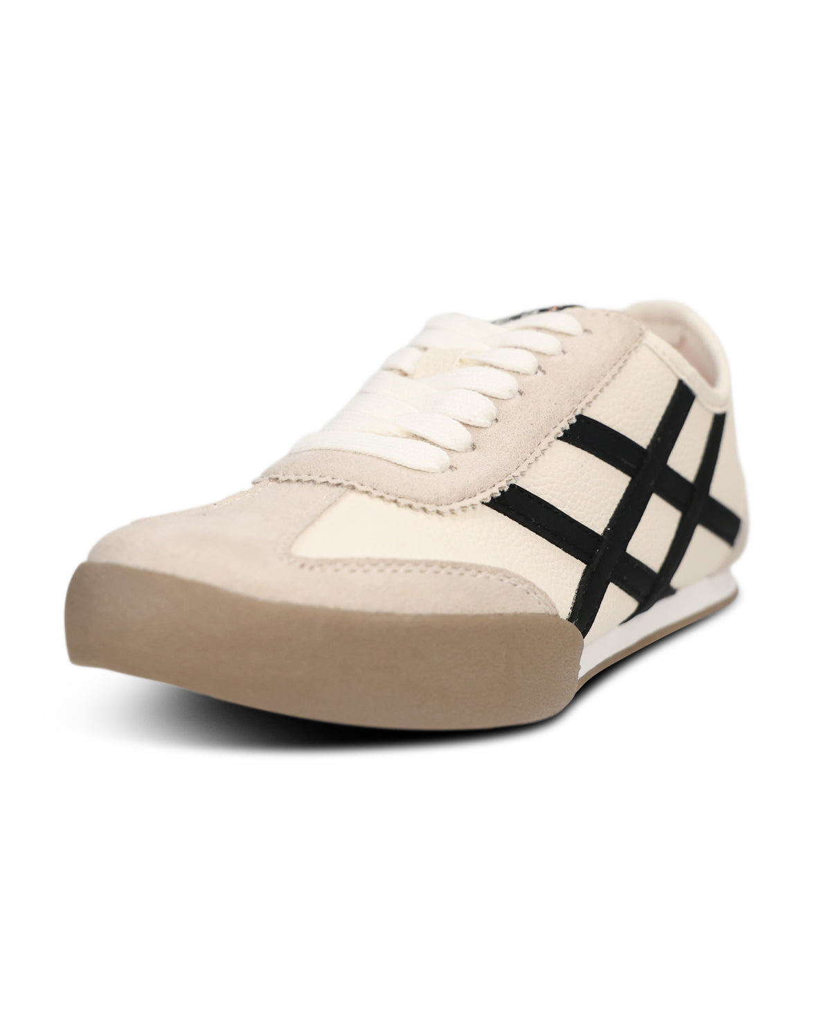 A low-top sneaker in off-white and beige suede with a black grid pattern on the side and a beige rubber sole, shown on a plain white background.