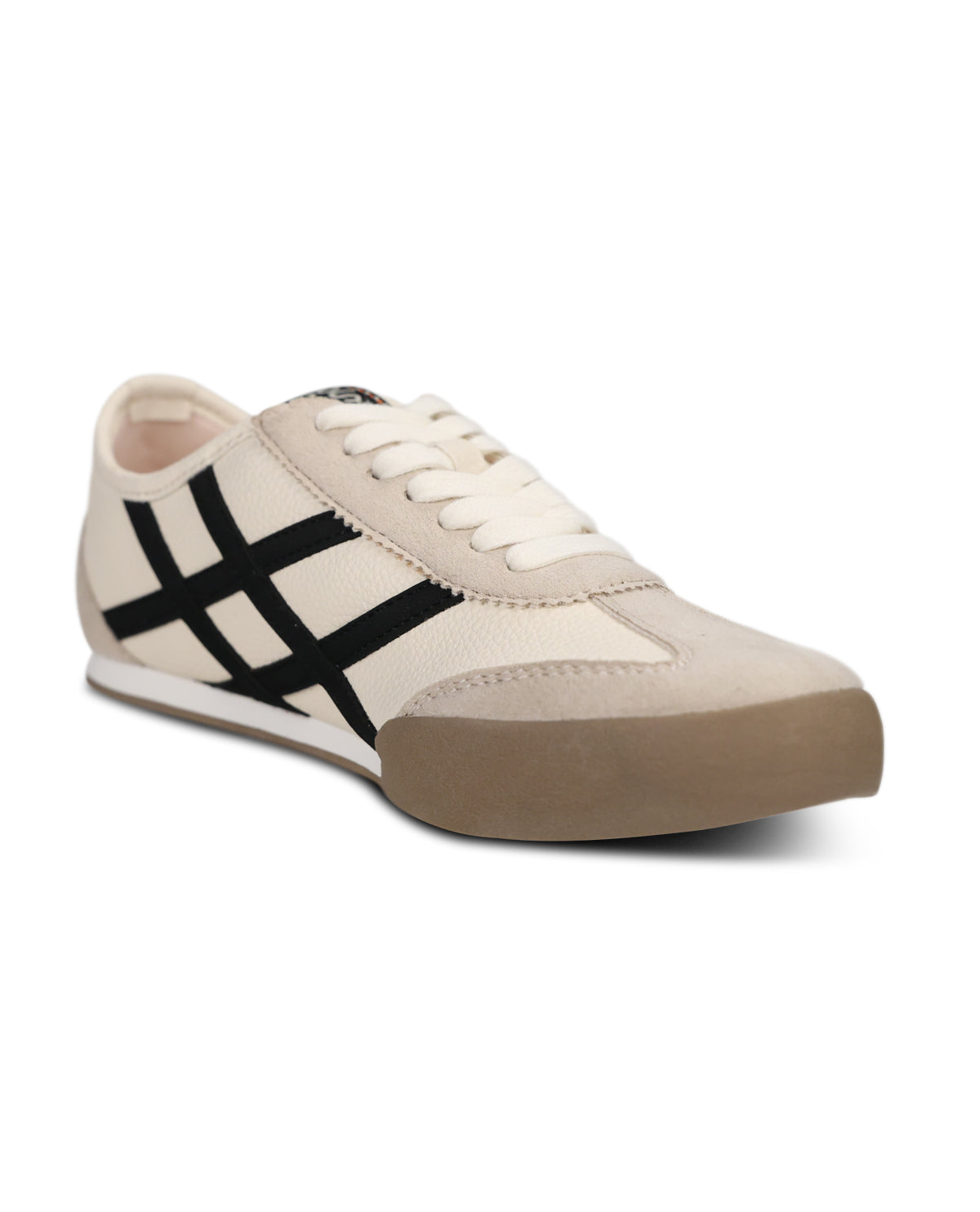 A low-top sneaker in off-white canvas with black diagonal stripes on the side, white laces, and a brown gum sole, shown against a plain white background.