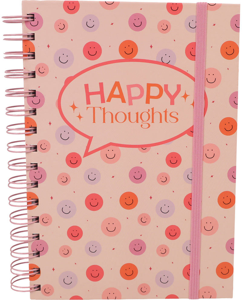 A spiral-bound notebook with a pink cover decorated with a pattern of smiley faces in various colors. A large speech bubble on the front reads 'HAPPY Thoughts' in orange and pink lettering, and a pink elastic closure band is visible on the right side.