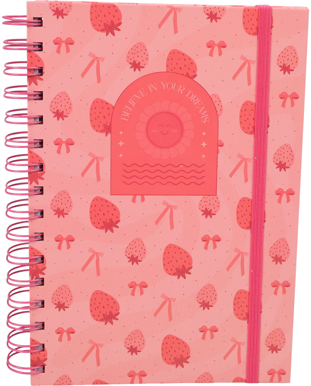 A pink spiral-bound notebook with a strawberry and bow pattern, featuring a central arch-shaped sticker that reads 'BELIEVE IN YOUR DREAMS' with a sun and moon illustration.