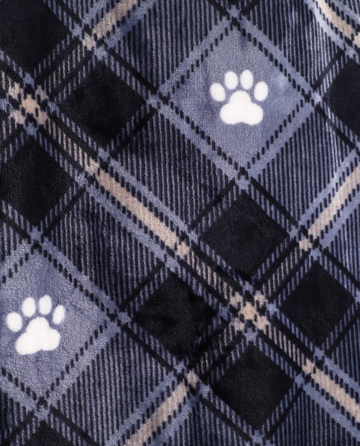 Close-up of a plush fabric with a navy and gray plaid pattern and white paw print motifs.