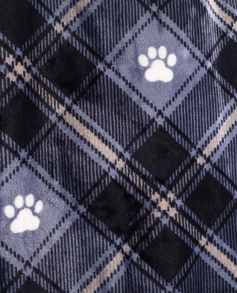 Close-up of a plush fabric with a navy and gray plaid pattern and white paw print motifs.