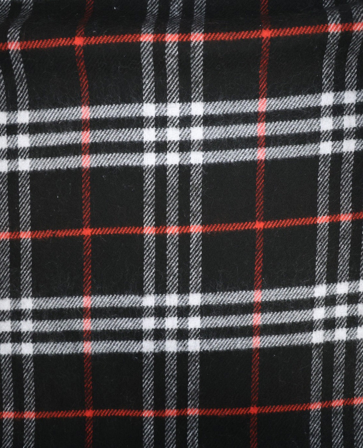 A close-up of a plaid fabric pattern with a black base, white and gray stripes, and thin red accent lines.