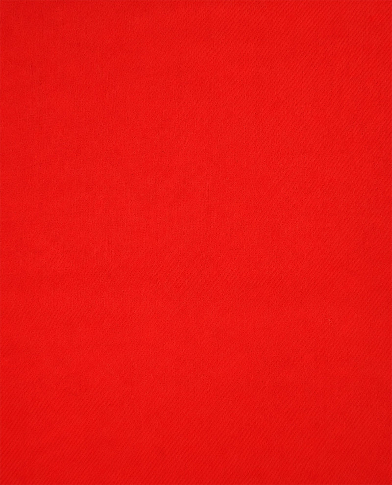 A close-up of a bright red textured fabric surface filling the frame.