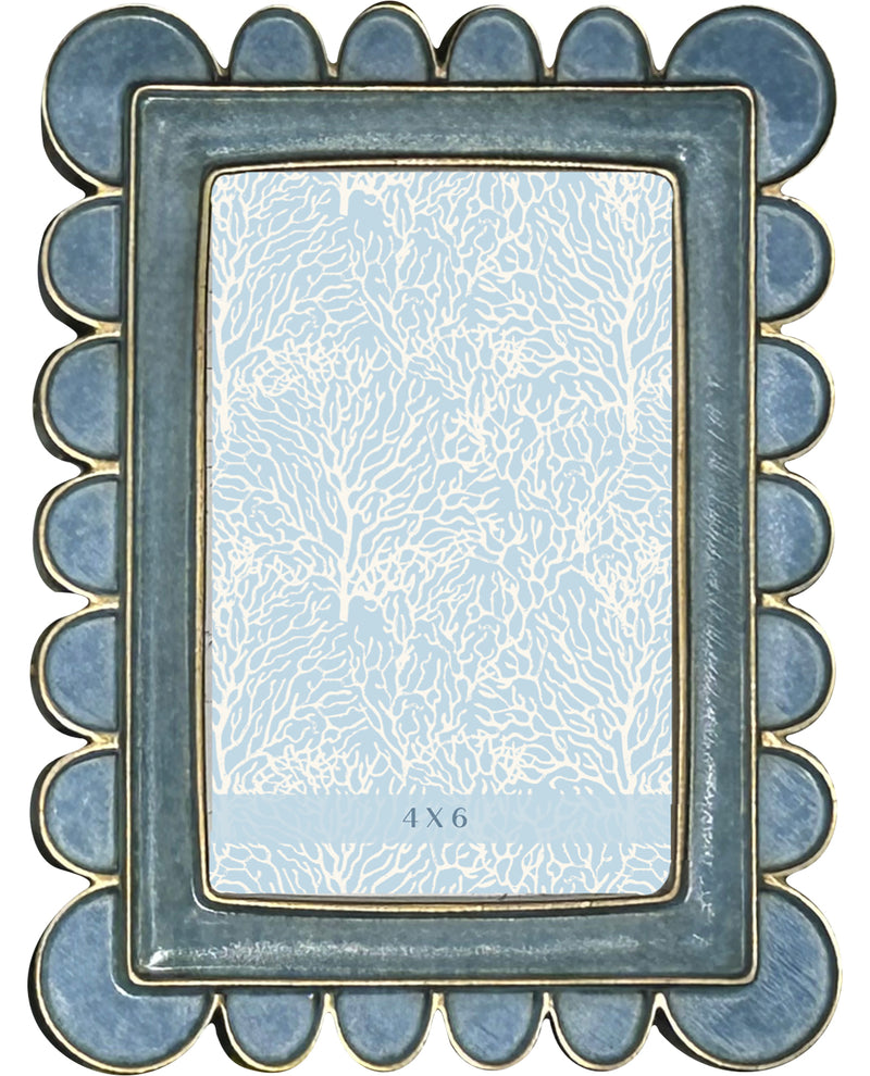 Decorative photo frame with scalloped edge and floral pattern on a white background
