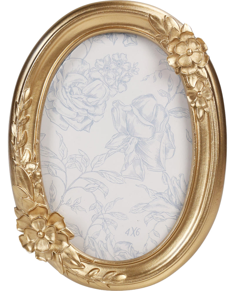 Gold ornate picture frame with floral designs on a white background