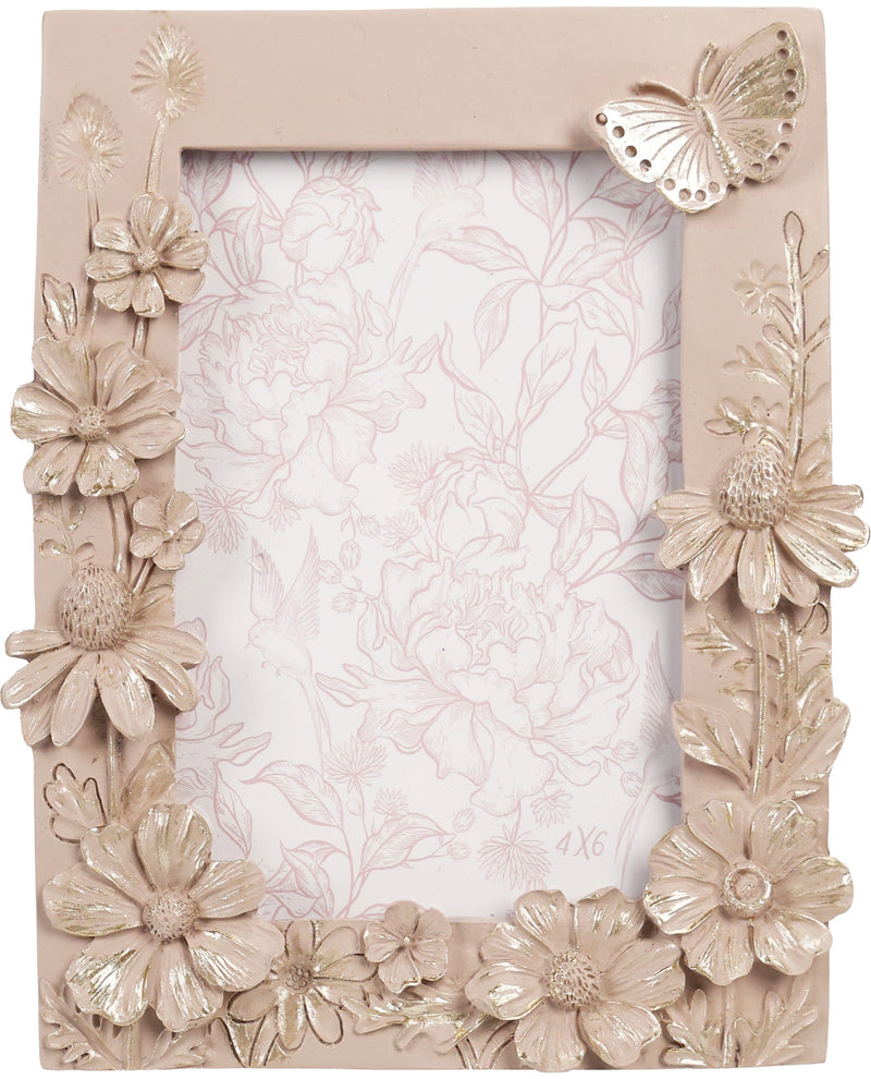 Decorative photo frame with floral and butterfly design on a beige background