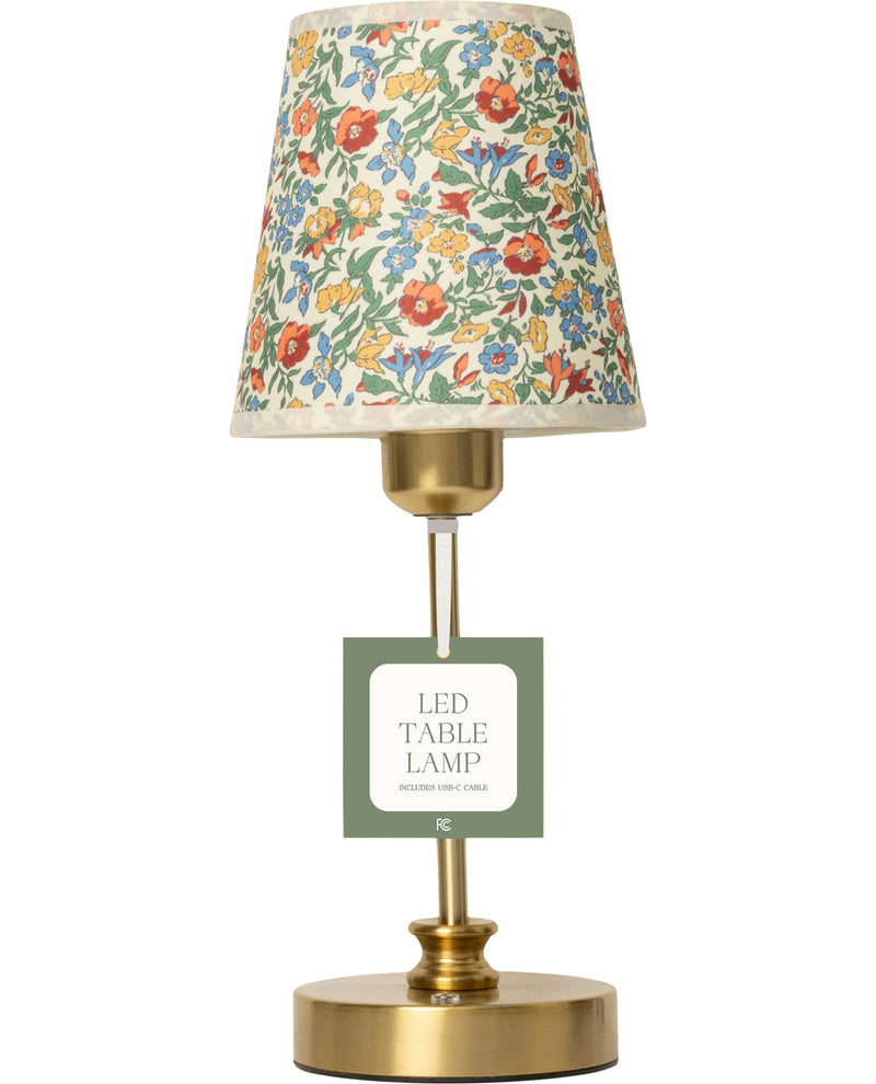 LED table lamp with floral-patterned shade on a white background