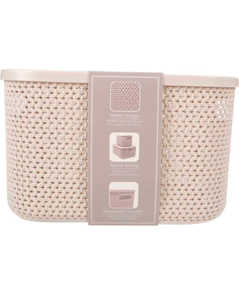 A woven mesh storage basket in a light beige or cream color, shown with its product packaging label attached to the front.