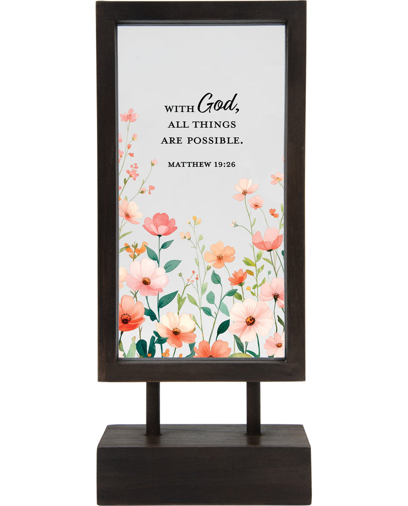 Decorative sign with floral design and motivational quote on a white background