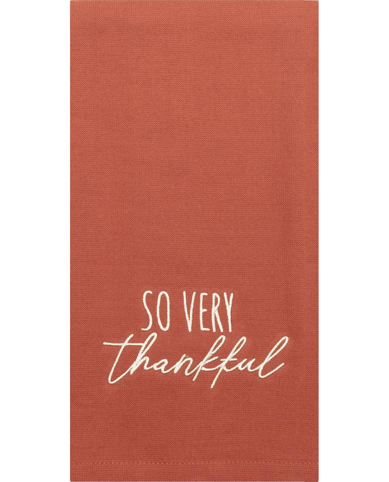 Brown towel with 'So Very Thankful' text on a white background
