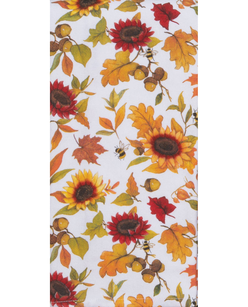 Fabric with autumn-themed pattern featuring sunflowers, leaves, and acorns on a white background.