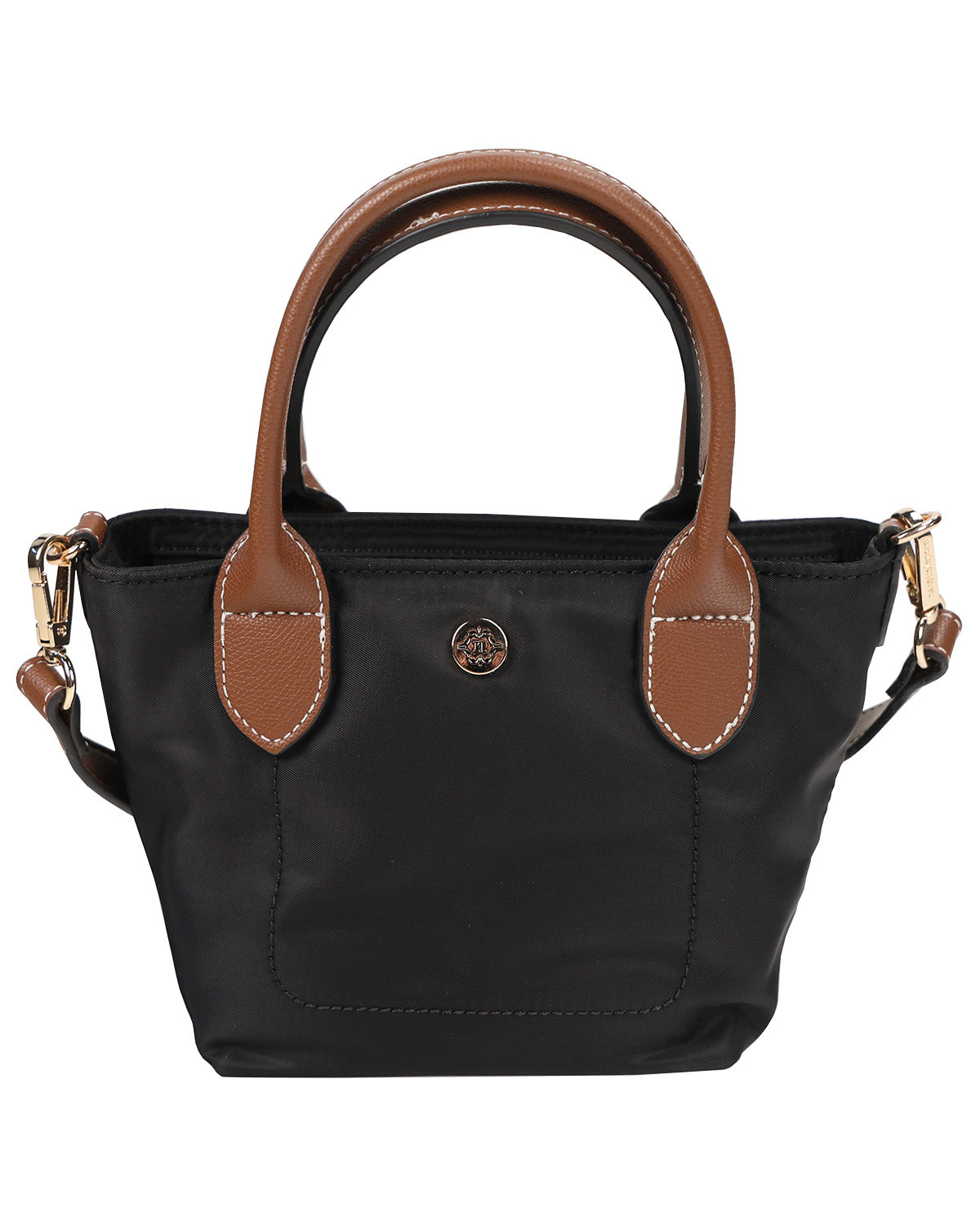 A black nylon handbag with brown leather handles and trim, featuring a gold-tone circular logo medallion on the front and gold hardware, set against a plain white background.