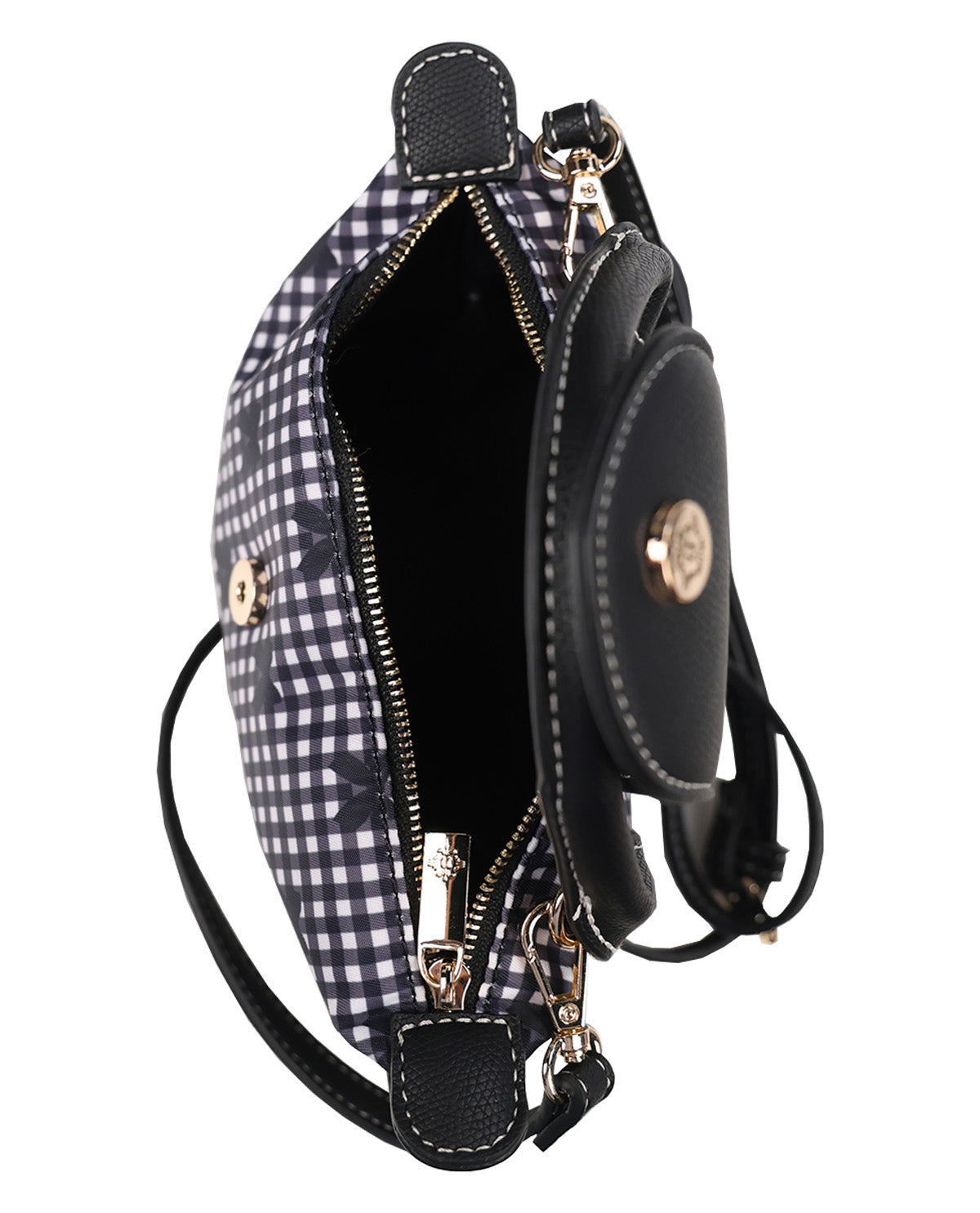 A black and white gingham check crossbody bag with black leather trim, gold-tone hardware, and a small round black leather coin purse attached on the front.