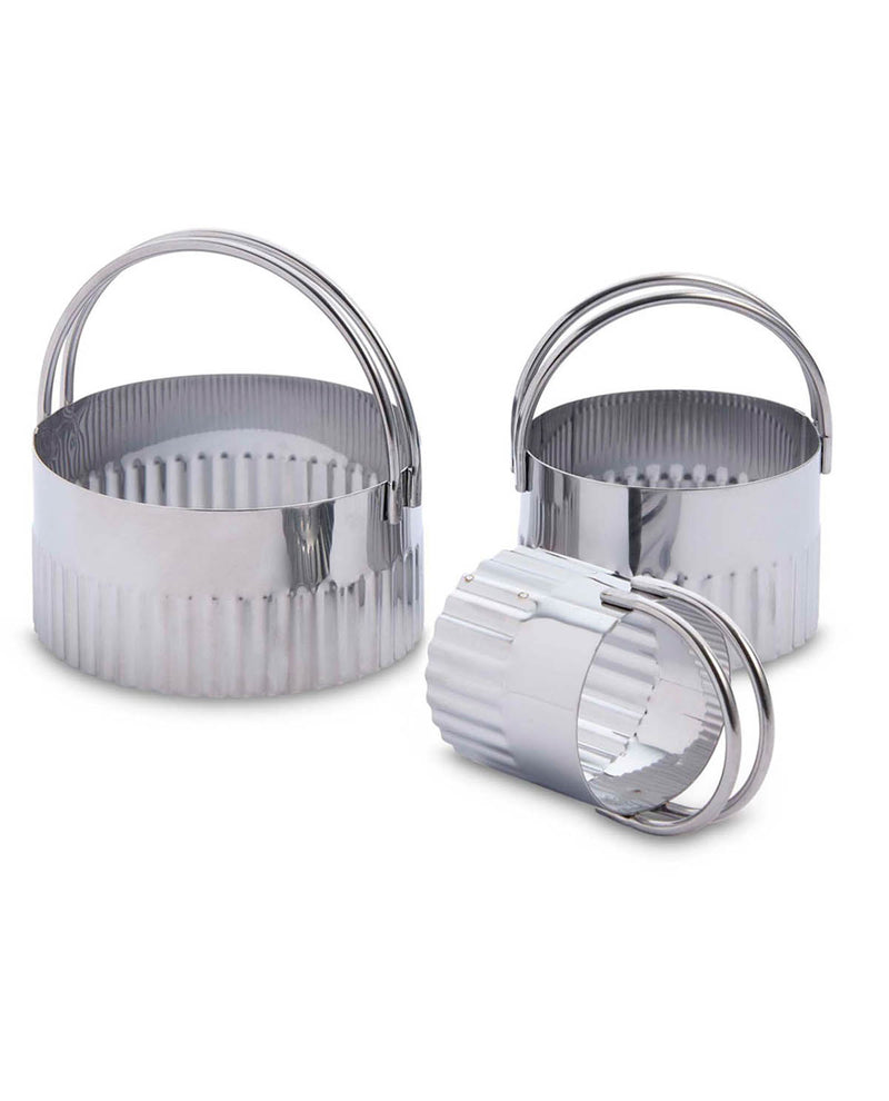 Set of three metal cookie cutters on a white background