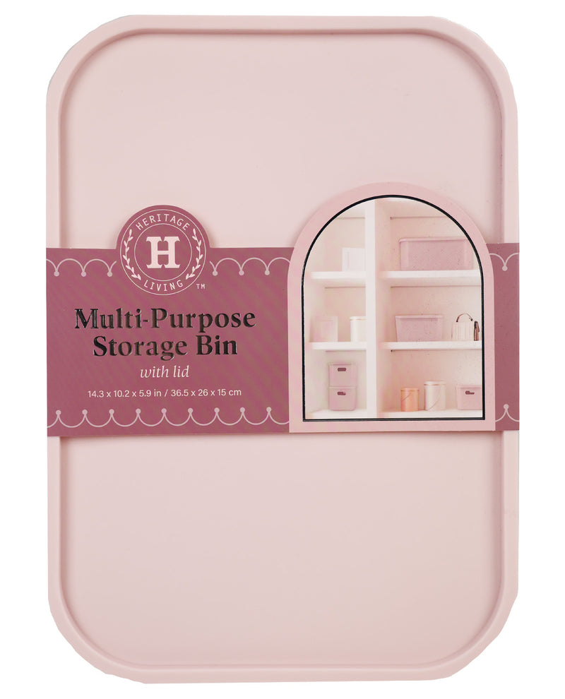 A pink multi-purpose storage bin with lid by Heritage Living, featuring a dusty rose paper label with product details and a small arched window illustration showing shelves inside.
