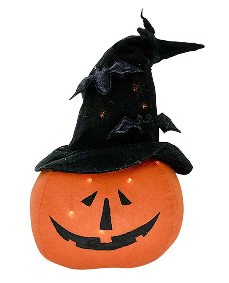 An orange jack-o'-lantern pumpkin with a carved black face, wearing a black witch hat with bat details, isolated on a white background.