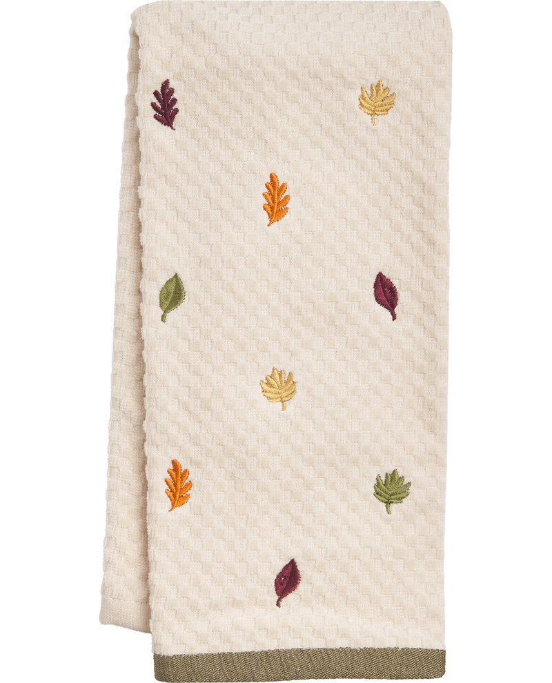 Beige towel with embroidered autumn leaves on a white background