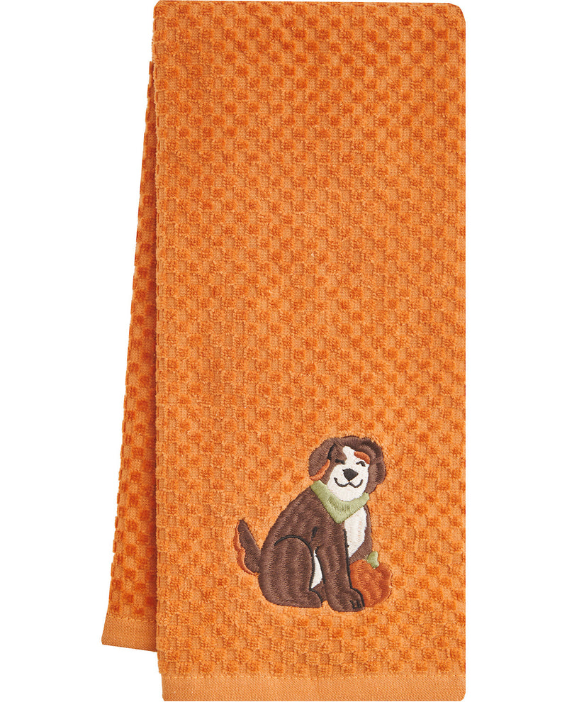 Orange towel with a dog and pumpkin design on a white background