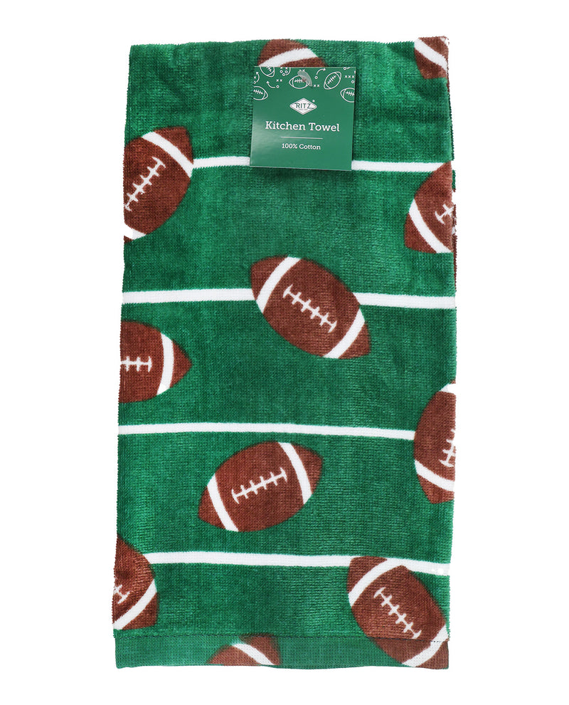 A green kitchen towel with a football pattern, featuring brown footballs with white laces and white horizontal stripes, with a green paper label at the top.