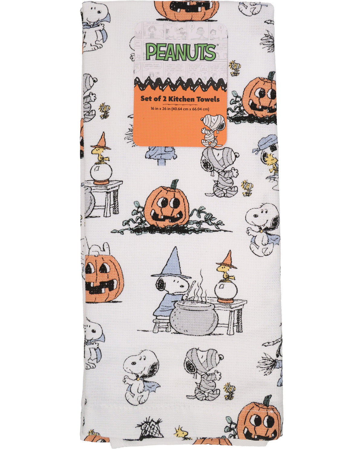 A set of three Peanuts-themed kitchen towels featuring Snoopy and Woodstock in Halloween costumes on an off-white background, with a cardboard header card.