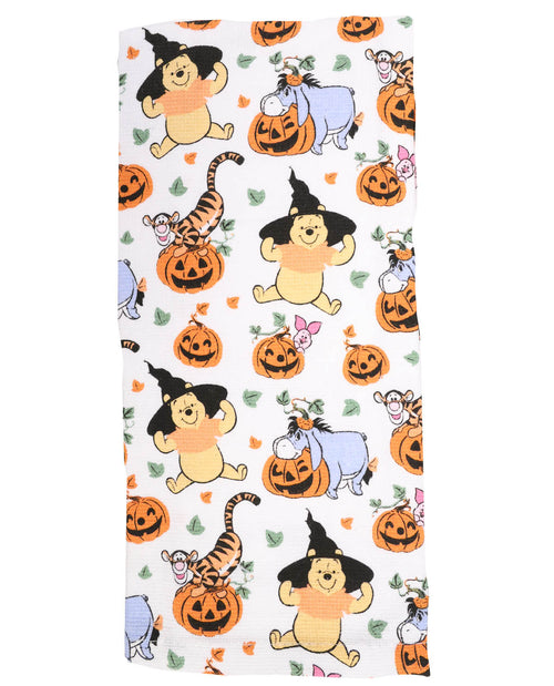 Halloween-themed fabric with cartoon characters and pumpkins on a white background