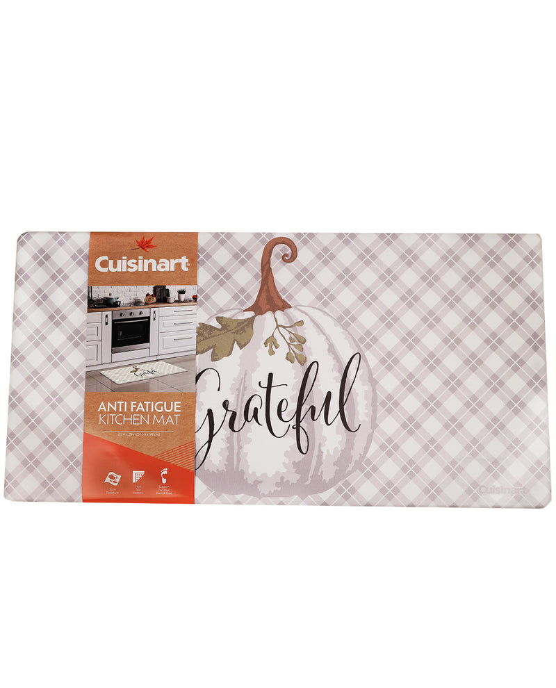 Cuisinart anti fatigue kitchen mat with a fall harvest theme, featuring a white pumpkin, autumn leaves, and the word 'grateful' on a pinkish plaid background.
