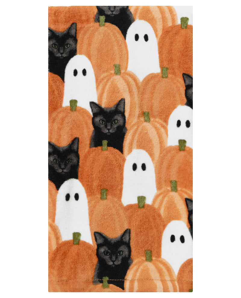 A rectangular towel featuring a repeating Halloween pattern of orange pumpkins, white ghosts, and black cats, shown flat against a white background.